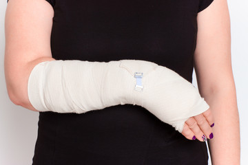 young female with broken hand in cast