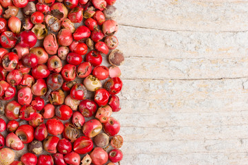 Red pepper on wooden white background