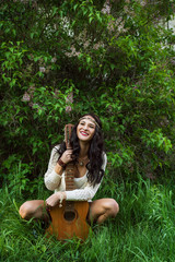  boho girl with guitar laughing