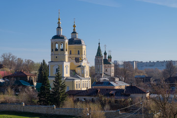 Fototapeta na wymiar Church of Elijah the Prophet and Church of the Holy Trinity on a spring morning in the town of Serpukhov in the Moscow region