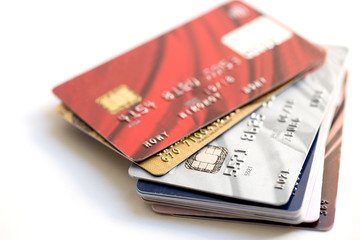 stack of credit cards on white background