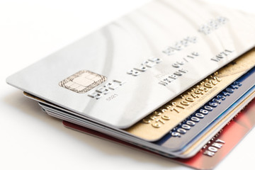 pile of credit cards on white background