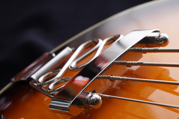 Closeup of electric guitar. Detail, selective focus.