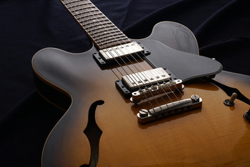 Fototapeta na wymiar Closeup of old electric guitar. Detail, selective focus.