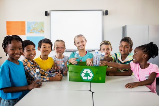 Portrait of pupils recycling