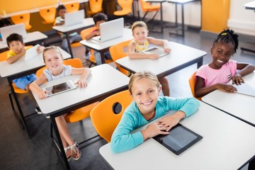 Close up view of pupils studying with laptop and tablet pc