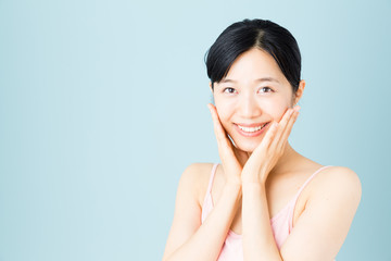 attractive asian woman skincare image on blue background