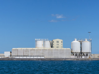 Harbor logistics, silos and warehouse.