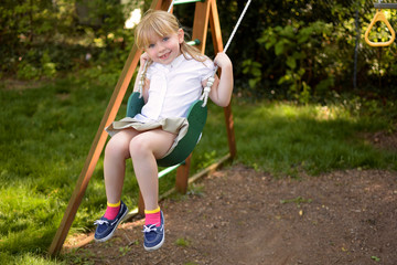 young girl swinging