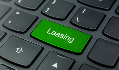Business Concept: Close-up the Leasing button on the keyboard and have Lime, Green color button isolate black keyboard