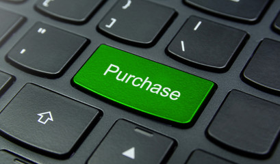 Business Concept: Close-up the Purchase button on the keyboard and have Lime, Green color button isolate black keyboard