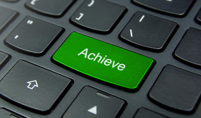 Business Concept: Close-up the Achieve button on the keyboard and have Lime, Green color button isolate black keyboard