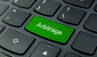 Business Concept: Close-up the Arbitrage button on the keyboard and have Lime, Green color button...