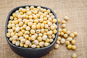 Gold soybean in black cup.