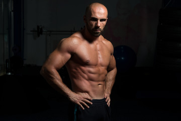 Fototapeta na wymiar Bodybuilder Showing His Well Trained Body