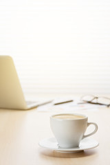 Office workplace with with laptop and coffee