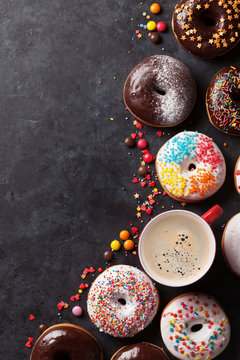 Colorful donuts and coffee cup