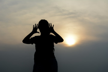 Fototapeta premium Silhouette women tourists.Background sunset