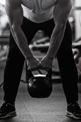 Fototapeta na wymiar Photo bodybuilder doing weight lifting in gym.