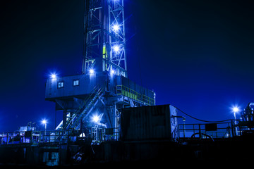 In the evening of oilfield derrick