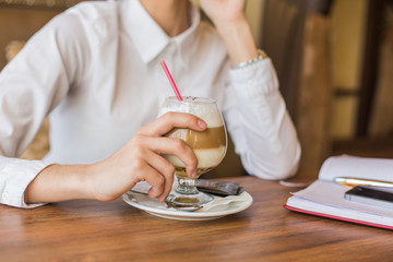 Fototapeta na wymiar Business woman drinking latte coffee in restaurant.