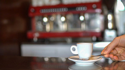 Cup of coffee served on the bar counter.