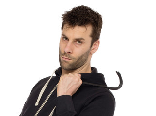 Crime concept. Criminal in hood with crowbar in hand