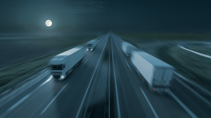 Motion image of modern delivery trucks on the highway at night