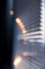 Sun shining through the blinds. Blured background.