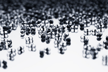 Minimalist abstract light background with transparent glass particles. The texture.