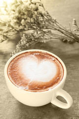 Coffee cup and beautiful flower