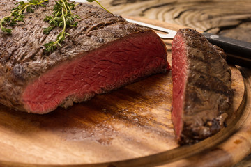 steak on wooden plate