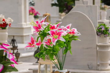 Beautiful flowers on a grave after a funeral.
