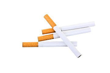 Cigarette with an orange filter lie close to each other isolated on white background