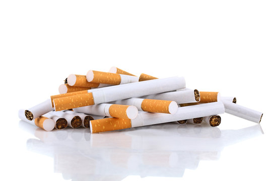 Cigarette with an orange filter lie close to each other isolated on white background
