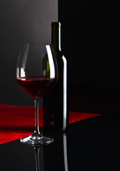  bottle and glass with red wine