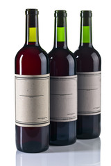  bottles of red wine isolated on white