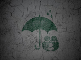 Safety concept: Family And Umbrella on grunge wall background