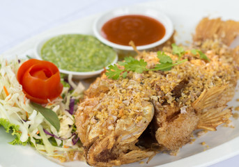 Deep Fried Red Tilapia with Garlic and Pepper, Thai food.