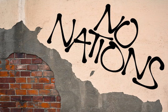 Handwritten graffiti No nations sprayed on the wall, anarchist aesthetics. Appeal to multiculturalism and to abolish nationalism and hatred