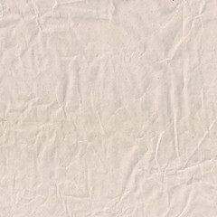 Craft crumpled recycled paper sheet photo texture. Wrapping paper with wrinkles