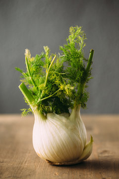 Close up of garlic bulb on wooden table