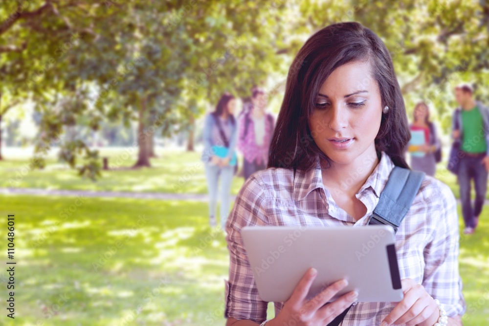 Poster composite image of young focused student using a tablet computer