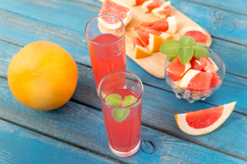 Orange and grapefruit juice in glass