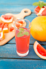 Orange and grapefruit juice in glass