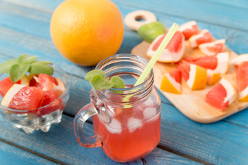 Orange and grapefruit juice in glass