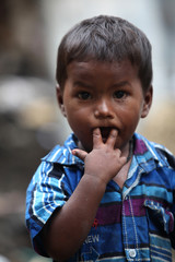 Pune, India - July 16, 2015: A portrait of a poor Indian boy put