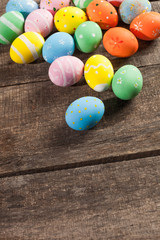 Fototapeta na wymiar Vintage colorful easter eggs on wood table background