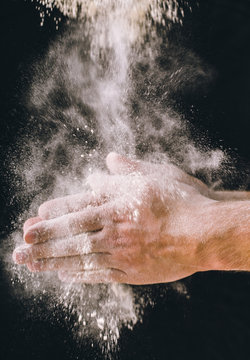 adult man hands work with flour, dark photo