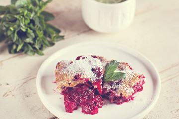 Cherry pie and a cup of tea. Rustic style. Berry pie. Homemade cherry pie with flaky crust, cup of coffee, bowl with cherries